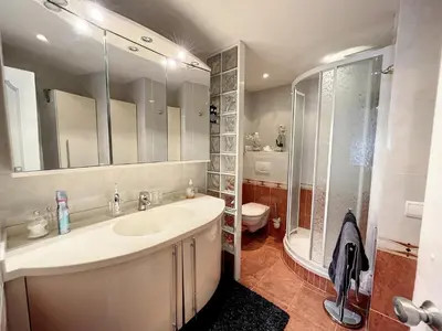 a bathroom with a sink and a shower and a toilet at Superbe 3 pièces vue mer 323L MUNAR in Cannes