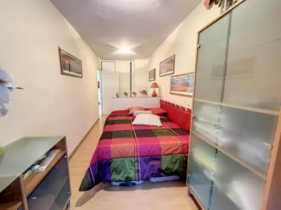 a small bedroom with a bed in a room at Superbe 3 pièces vue mer 323L MUNAR in Cannes