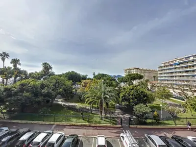 a parking lot with cars parked in a park at STUDIO MIDI MAGRET Cannes in Cannes