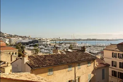 a view of a harbor with boats in the water at Le Suquet - Château - Palais - Seaview - WIFI in Cannes
