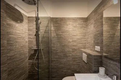 a bathroom with a shower and a toilet and a sink at Le Suquet - Château - Palais - Seaview - WIFI in Cannes
