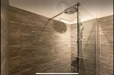 a bathroom with a shower with a glass door at Le Suquet - Château - Palais - Seaview - WIFI in Cannes