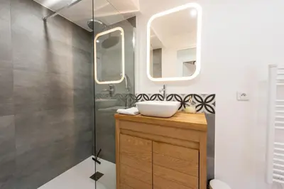 a bathroom with a sink and a shower at 3P Central Cannes Suquet in Cannes