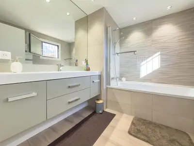 a bathroom with a sink and a tub and a shower at Le Marcellin by Winsome Destination in Cannes