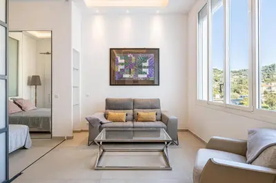 a living room with a couch and a table at REF 1975 - Cannes Center - Croisette in Cannes