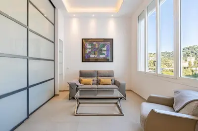 a living room with a couch and a table at REF 1975 - Cannes Center - Croisette in Cannes