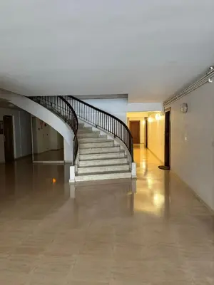 an empty hallway with a staircase in a building at Le Chevreuse Cannes centre-ville in Cannes