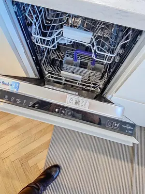 a dishwasher with the dishes inside of it at 3p Quai St Pierre - 348L Alexa in Cannes