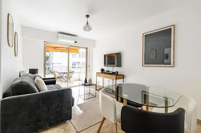 a living room with a couch and a glass table at Joli 2 pcs - Prox Martinez in Cannes