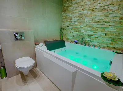 a bathroom with a toilet and a bath tub with at Appartement Vaste Horizon - LRA Cannes in Cannes