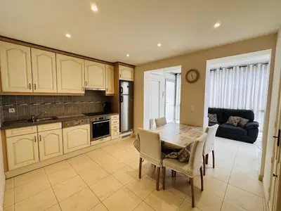 a kitchen and dining room with a table and chairs at Two bedroom apartment on a high floor in the center of Cannes a few steps from the Croisette beaches - 2229 in Cannes