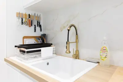 a kitchen counter with a sink and a faucet at Carlton area superb 1 bedroom in Cannes