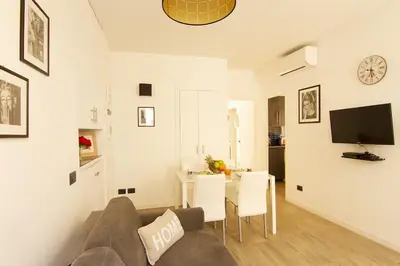 a living room with a couch and a table at Magnifique T2 au cœur de Cannes in Cannes