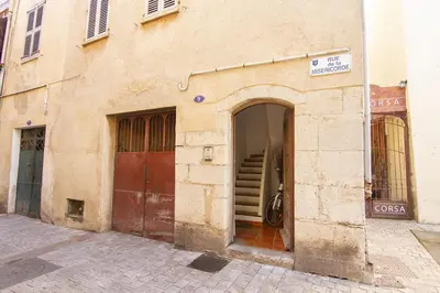 an entrance to a building with a door and a staircase at Magnifique T2 au cœur de Cannes in Cannes