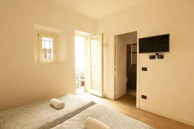 a bedroom with a bed and a television on a wall at Magnifique T2 au cœur de Cannes in Cannes