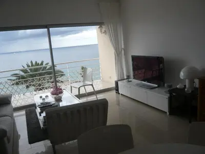 a living room with a view of the ocean at Coeur de Cannes in Cannes