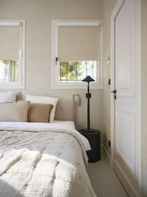 a white bedroom with a bed and a window at Cannes, splendide villa dans un domaine privé in Le Cannet