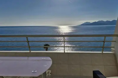 a bathroom with a sink and a view of the ocean at Cannes SEASIDE BEACHFRONT bord de mer in Cannes