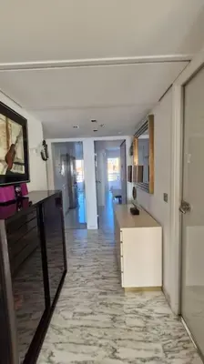 a living room with a hallway with a counter and a room with a unintention at Cannes SEASIDE BEACHFRONT bord de mer in Cannes