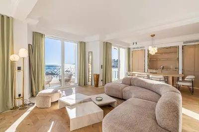 a living room with a couch and a table at 1974 - Luxurious 3 bedrooms - Sea view & Parking in Cannes