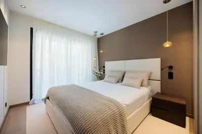 a bedroom with a large bed and a large window at 1973 - Luxurious waterfront apartment Croisette in Cannes