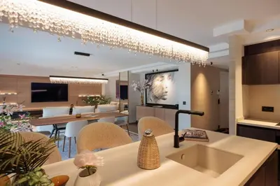 a kitchen and living room with a table and chairs at 1973 - Luxurious waterfront apartment Croisette in Cannes