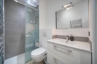 a bathroom with a toilet and a sink and a shower at Le Nico - Elégant - Centre - VCA in Cannes