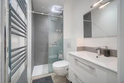 a bathroom with a toilet and a sink and a shower at Le Nico - Elégant - Centre - VCA in Cannes