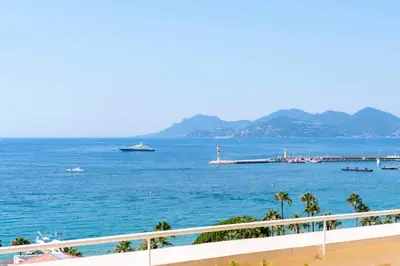 a view of the ocean with a boat in the water at Cannes - Roof terrace for rent in Cannes