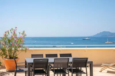 a table and chairs with a view of the ocean at Cannes - Roof terrace for rent in Cannes