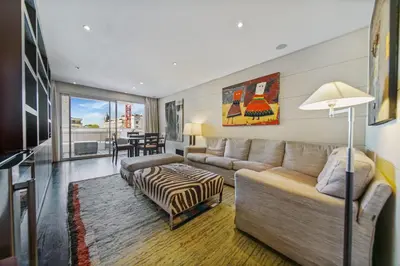a living room with a couch and a table at REF 1319 - Cannes Center - Apartment for rent in Cannes