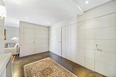 a room with white walls and a rug at REF 1319 - Cannes Center - Apartment for rent in Cannes