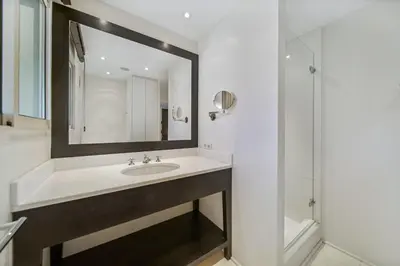 a bathroom with a sink and a mirror at REF 1319 - Cannes Center - Apartment for rent in Cannes
