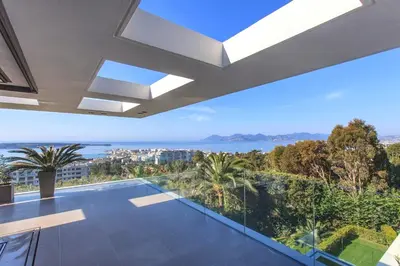an empty house with a view of the ocean at REF 1960 - Cannes - Sea view villa for rent in Cannes