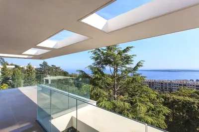 a house with a view of the ocean at REF 1960 - Cannes - Sea view villa for rent in Cannes