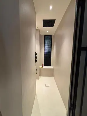 a room with a hallway with a window and a staircase at Palm Beach front de mer in Cannes