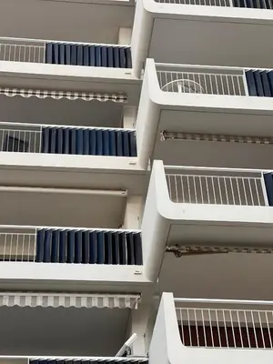a facade of an office building with white shelving at Palm Beach front de mer in Cannes