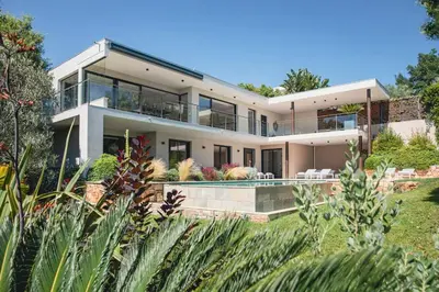 an exterior view of a house with a garden at REF 2152 - Le Cannet - Sea view villa for rent in Le Cannet