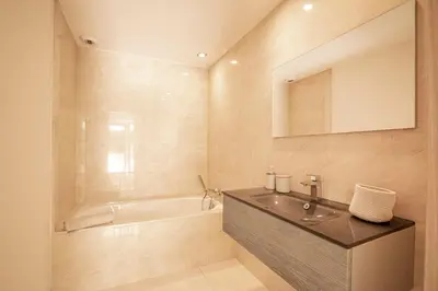 a bathroom with a sink and a bath tub at REF 2152 - Le Cannet - Sea view villa for rent in Le Cannet