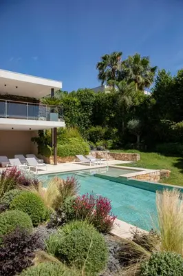 a swimming pool in front of a house at REF 2152 - Le Cannet - Sea view villa for rent in Le Cannet