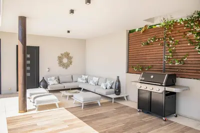 a living room with a couch and a stove at REF 2152 - Le Cannet - Sea view villa for rent in Le Cannet