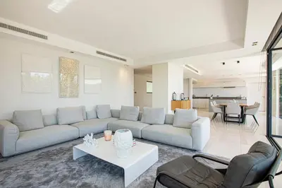 a living room with a couch and a table at REF 2152 - Le Cannet - Sea view villa for rent in Le Cannet
