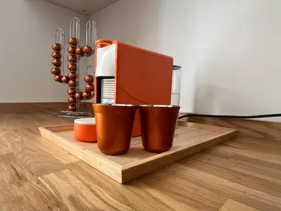 a coffee maker sitting on a wooden cutting board at Splendide maison Solstice in Cannes