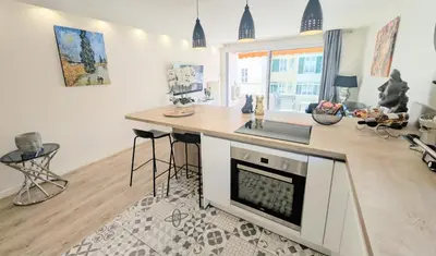 a kitchen with a counter and a kitchen island with a sink at 