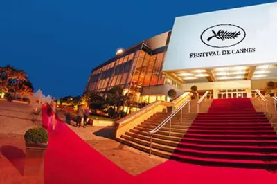 a red carpeted staircase in front of a building at Stanislas sea view in Cannes