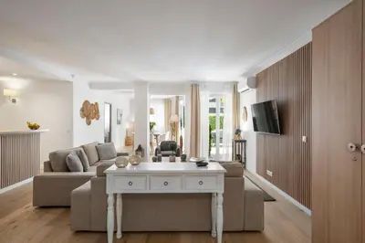 a living room with a couch and a table at Cannes Center, Nice 110m2, 3BR & 3BTH, Terrace in Cannes
