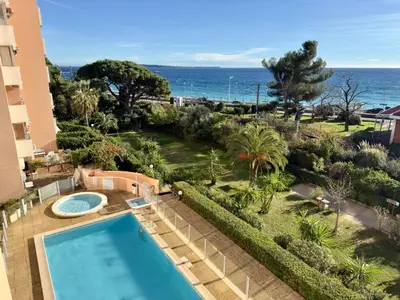 an aerial view of a resort with a swimming pool and the ocean at Vogue By SCLS Locations in Cannes