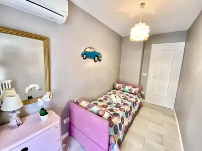 a living room with a couch and a mirror at Palais Royal Croisette GIA5407 in Cannes