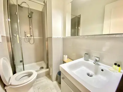 a bathroom with a toilet and a sink and a shower at Palais Royal Croisette GIA5407 in Cannes