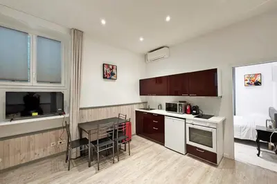 a kitchen with a table and a counter top at REF 1971- Apartment for rent basse Californie in Cannes